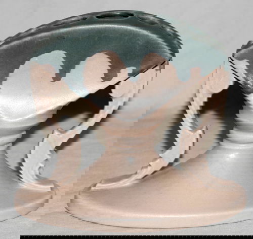 ROSEVILLE POTTERY FLOWER HOLDER, CORNEALIAN: ROSEVILLE "CORNELIAN DRIP" PATTERN POTTERY FLOWER HOLDER, C. 1926, H 6", W 7":Pink and blue. Art deco design. Blue mark under glaze. Marked "R".