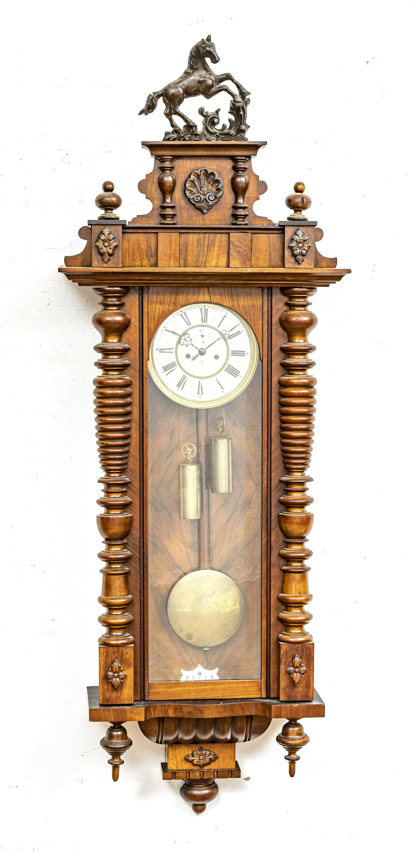 VIENNESE CARVED WALNUT WALL CLOCK, H 40", W 20": VIENNESE CARVED WALNUT WALL CLOCK, H 40", W 20" Marked "G.B." crown and anchor mark.