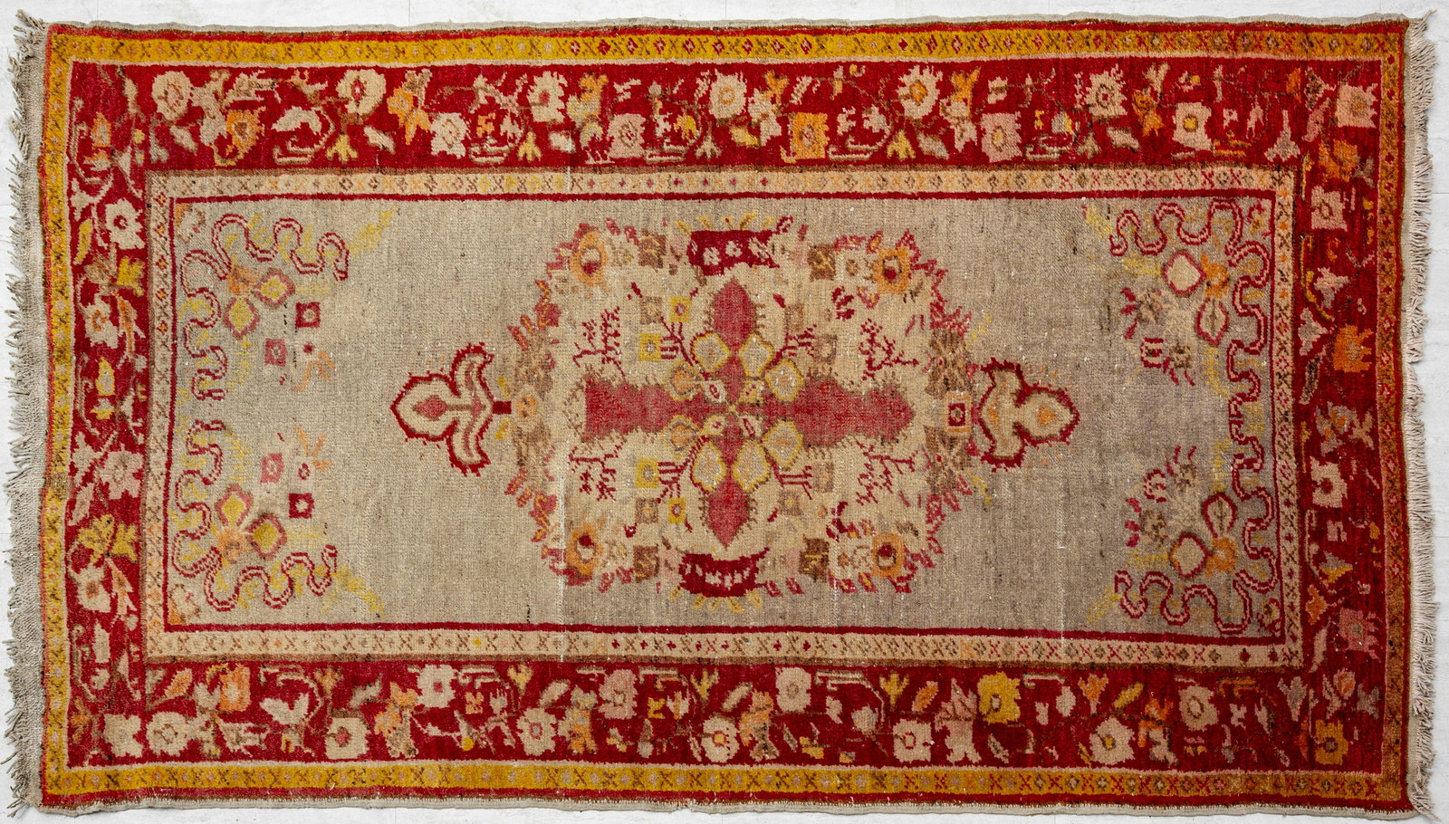 SEMI-ANTIQUE TURKISH OUSHAK HANDWOVEN WOOL RUG: SEMI-ANTIQUE TURKISH OUSHAK HANDWOVEN WOOL RUG, W 3' 6", L 6' 4" Having large central medallion.