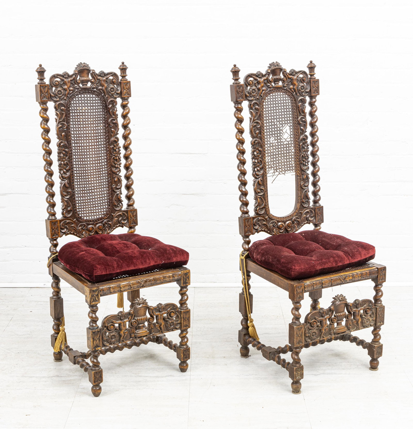 CARVED WOOD WITH CANE BACK HALL CHAIRS, PAIR: CARVED WOOD WITH CANE BACK HALL CHAIRS, PAIR, H 50 3/4", W 18", D 18" Barley twist legs and back. Decorated with cherubs flanking a cornucopia.