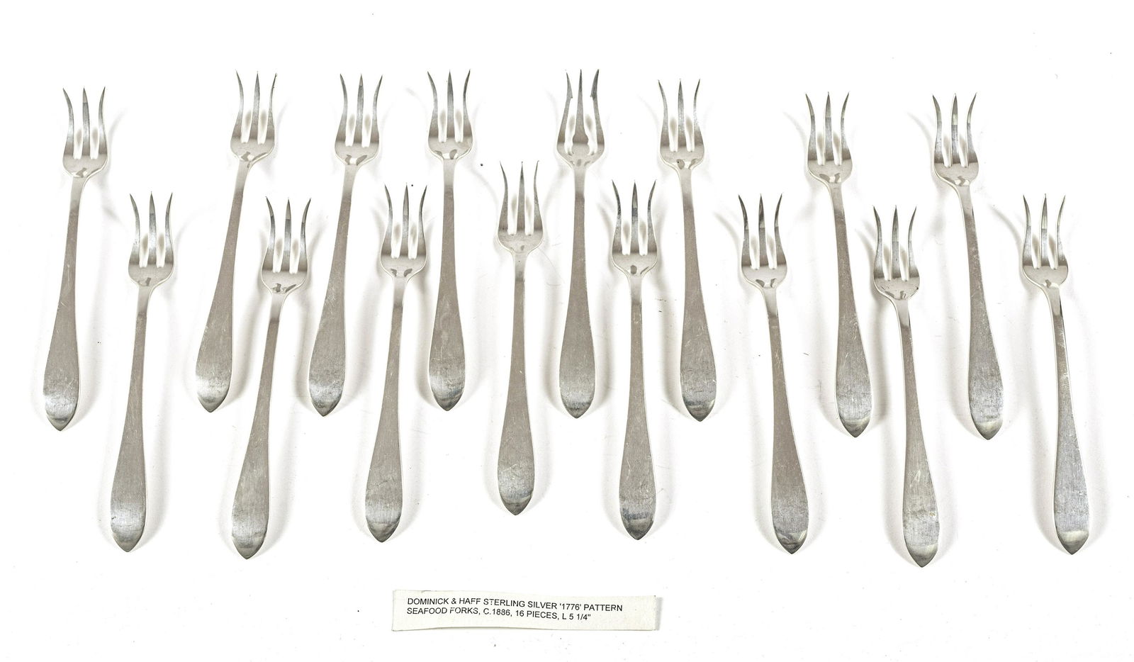 DOMINICK & HAFF STERLING SILVER SEAFOOD FORKS: DOMINICK & HAFF STERLING SILVER SEAFOOD FORKS C. 1886 (16 PCS) 8.8 T.O. 1890 "Broad Antique" pattern, length 5.2". Period monogram on underside "HHB".