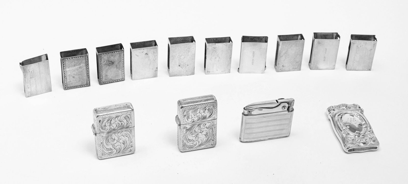 STERLING SILVER 10 MATCHBOXES, 3 LIGHTERS: STERLING SILVER 10 MATCHBOXES, 3 LIGHTERS, 1 HINGED MATCHBOX (14 PCS) 4.2 Tr. Oz. weight (not including lighters). One Ronson lighter, two sterling matching lighters (no trademark). Hinged match safe