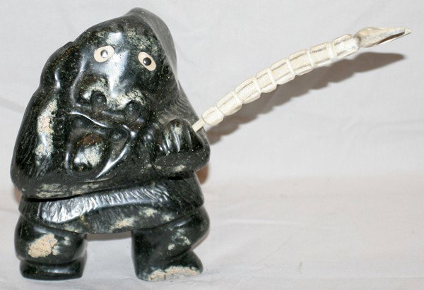 INUIT CARVED FIGURE HOLDING SPEAR, H 10", L 6": INUIT CARVED FIGURE HOLDING SPEAR, H 10", L 6", APPROXIMATELY: