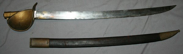US NAVEL CUTLASS & SCABBARD 18TH C, L 27" BLADE: U.S. NAVEL CUTLASS AND SCABBARD, 18TH C, L 27" BLADE:having a brass basket hand guard, and an anchor engraved on base of blade; scabbard is of leather with brass fittings;