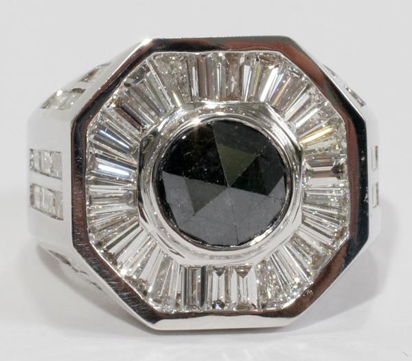 3 CT. NATURAL BLACK DIAMOND & BAGUETTE RING: 3.00 CT. NATURAL BLACK DIAMOND & 4.50 CT. BAGUETTE RING:Size 9 1/2. Baguettes G-color, Vs-1, Vs-2 clarity. 14kt white gold. Total weight 20.0 grams.