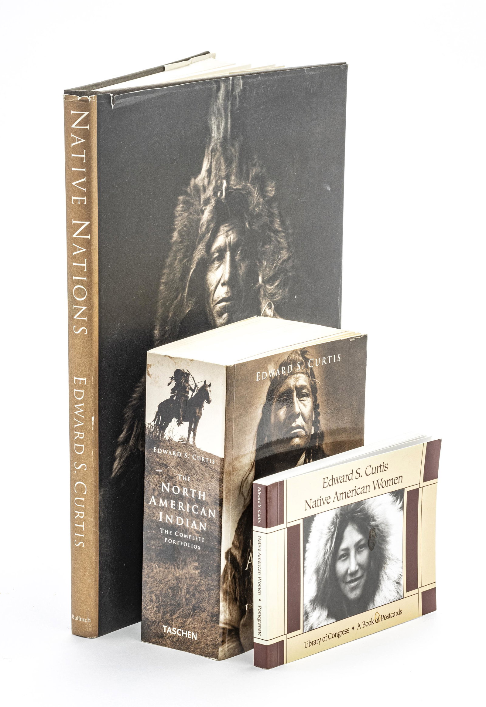 EDWARD SHERIFF CURTIS (AMERICAN, 1868-1952): EDWARD SHERIFF CURTIS (AMERICAN, 1868-1952) PHOTOGRAVURE ON PAPER + 3 BOOKS, H 6", W 8", "ON THE RIVER..." A photogravure titled "On The River - Puget Sound" after Edward Sheriff Curtis's 1912 photogr