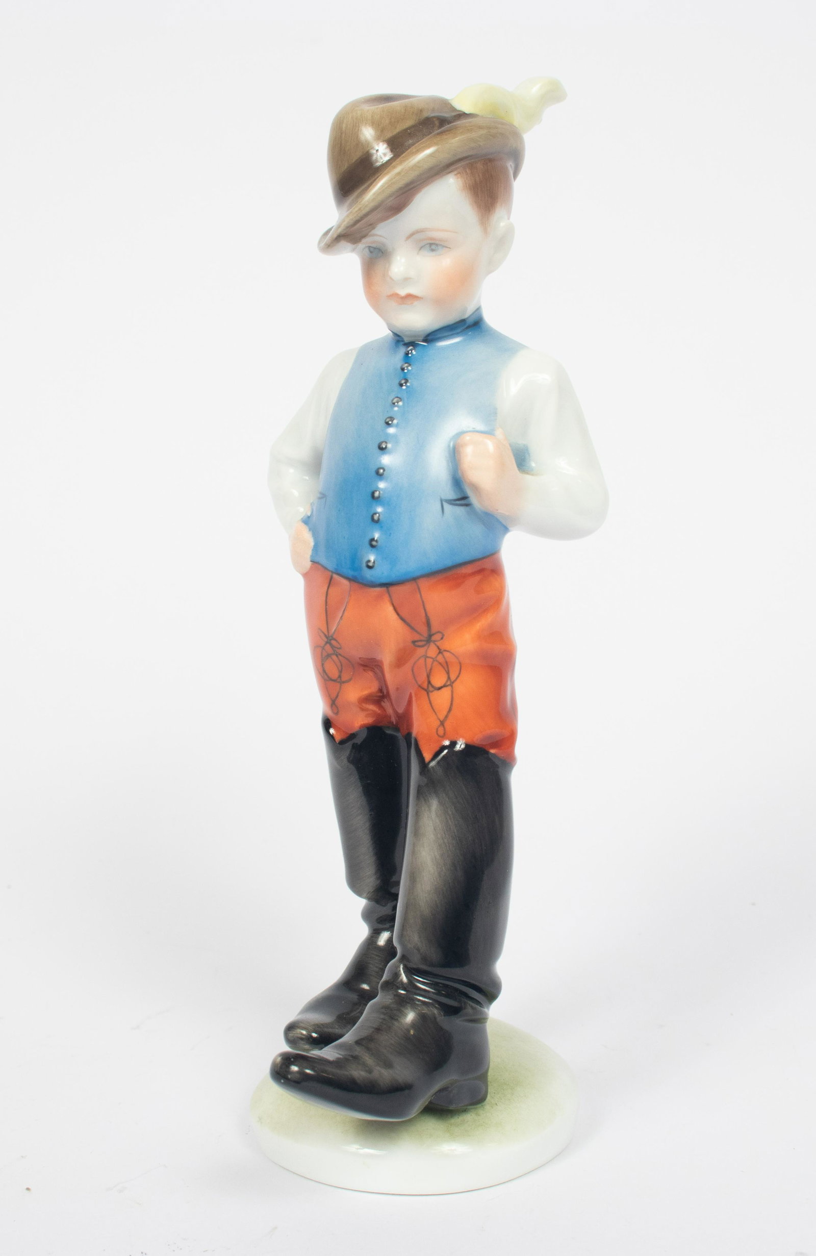 HEREND, (HUNGARY) PORCELAIN FIGURINE H 8" DIA 4" "BOY: HEREND, (HUNGARY) PORCELAIN FIGURINE H 8" DIA 4" "BOY IN FATHER'S BOOTS" Trademark. From the Estate of Renate Gilmore, Brighton, Mich.