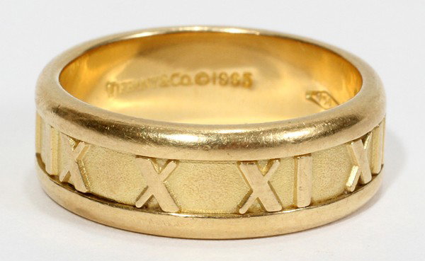 TIFFANY & CO. 18KT GOLD ETERNITY RING: TIFFANY & CO. 18KT GOLD ETERNITY RING:Size 8. Stamped Tiffany and 18kt. Total weight 9.4 grams.