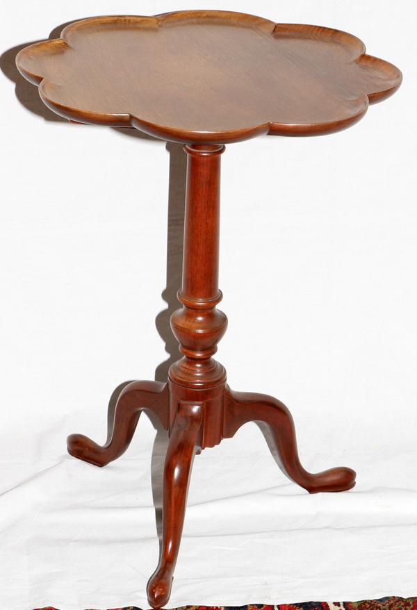 QUEEN ANNE STYLE MAHOGANY TILT-TOP TABLE, : QUEEN ANNE STYLE MAHOGANY TILT-TOP TABLE, C. 1940, H 27", DIA 19 1/2":Having a scalloped edge. From the collection of Dr Douglas Crary, Ann Arbor, Mi.