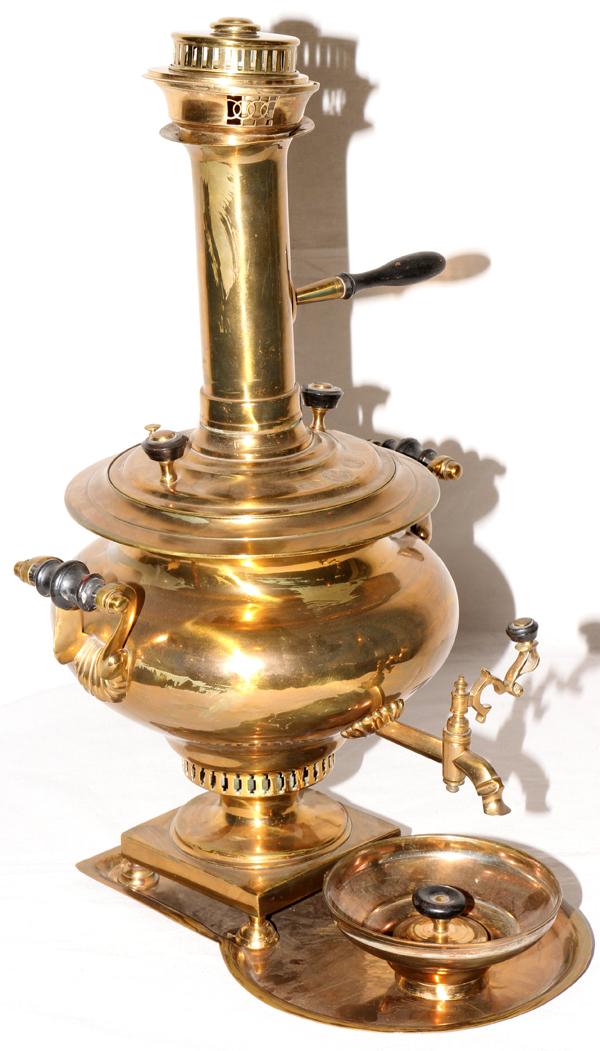 RUSSIAN BRASS SAMOVAR, 19TH C., H 23", W 15": RUSSIAN BRASS SAMOVAR, 19TH C., H 23", W 15":Turned wood handles, brass spigot, with under tray, dish and stack. From the collection of Dr Douglas Crary, Ann Arbor, Mi.