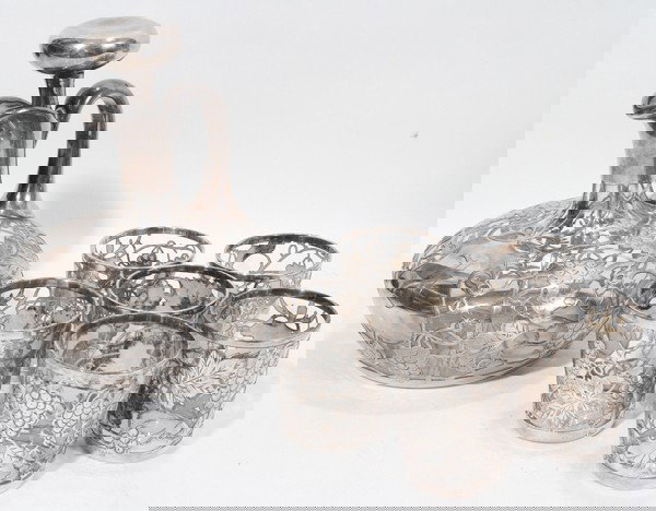 STERLING SILVER OVERLAY DECANTER AND GLASSES,: STERLING SILVER OVERLAY DECANTER AND GLASSES, SEVEN PIECES:The decanter, which has a stopper, is H 7", Dia 6" while the glasses are H 2 1/2", Dia 2 1/8".