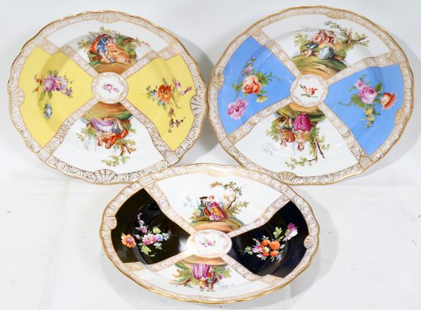 MEISSEN PLATES, THREE, DIA 9 1/2"-9 3/4": MEISSEN HAND-PAINTED PLATES, THREE, DIA 9 1/2"-9 3/4":Rimmed porcelain plates, panel style with courting couples. Impressed numerals and blue crossed swords under glaze, 1 blue, 1 black, 1 yellow.