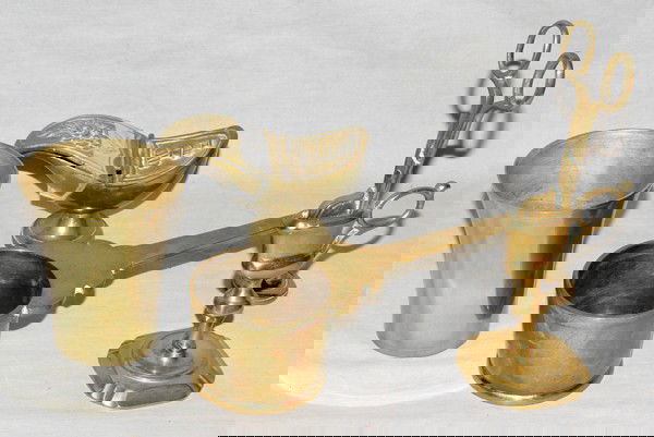 ENGLISH ANTIQUE BRASS MUG, WICK TRIMMER, &: ENGLISH ANTIQUE BRASS MUG, WICK TRIMMER, AND TUMBLER:Mug with an extending handle, L 9"; wick trimmer in holder H 8"; brass tumbler. Together with a brass incense container, pedestal base, H.5", with