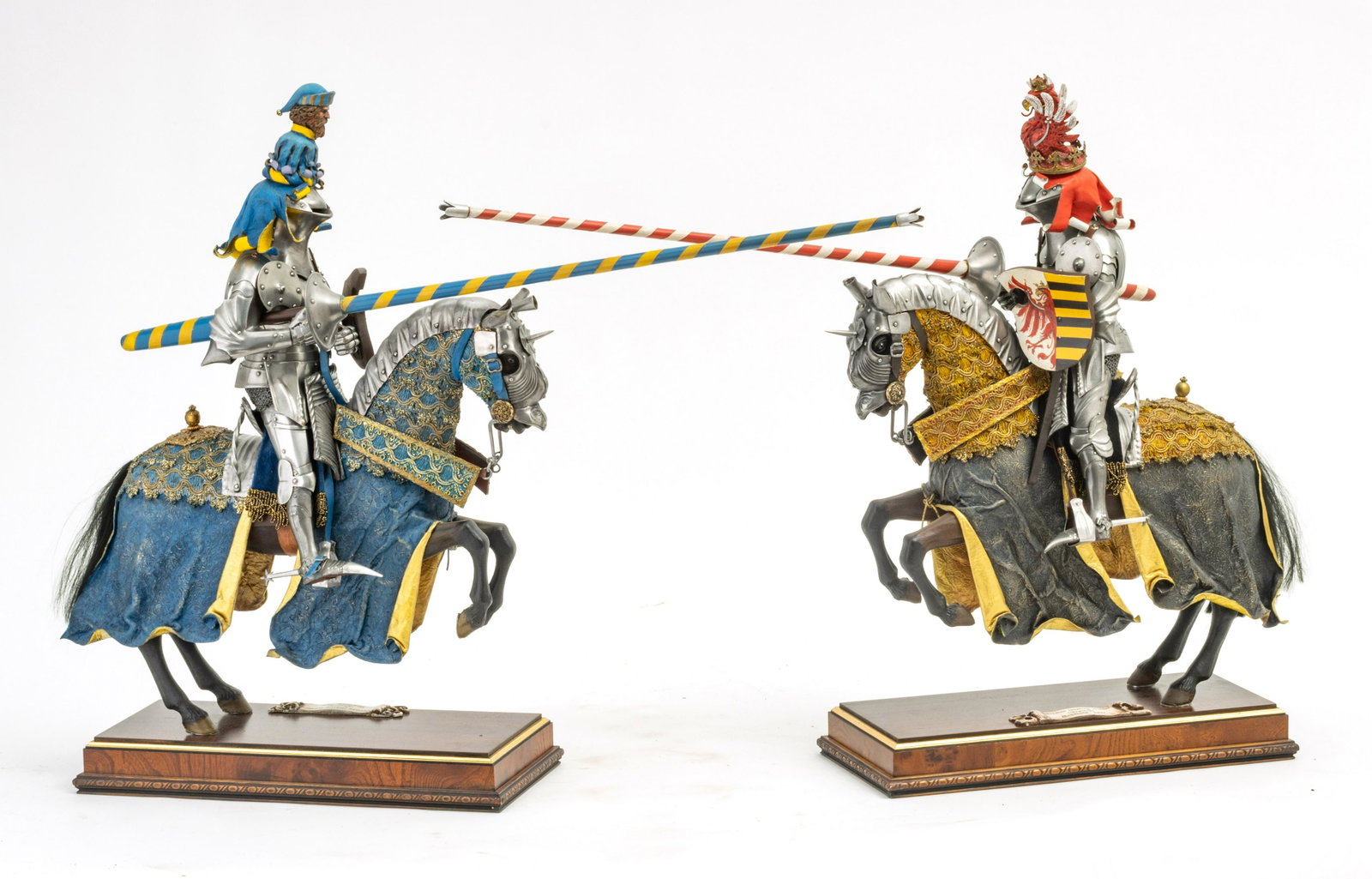 JOUSTING KNIGHTS, CARVED WOOD, POLYCHROME, LEATHER, AND: JOUSTING KNIGHTS, CARVED WOOD, POLYCHROME, LEATHER, AND METAL SCULPTURES PAIR H 21" W 30" D 5.5" Mixed media. Replica German jousting knights in armor, (Gestech) Augsburg, 1497. Provenance: Estate of 
