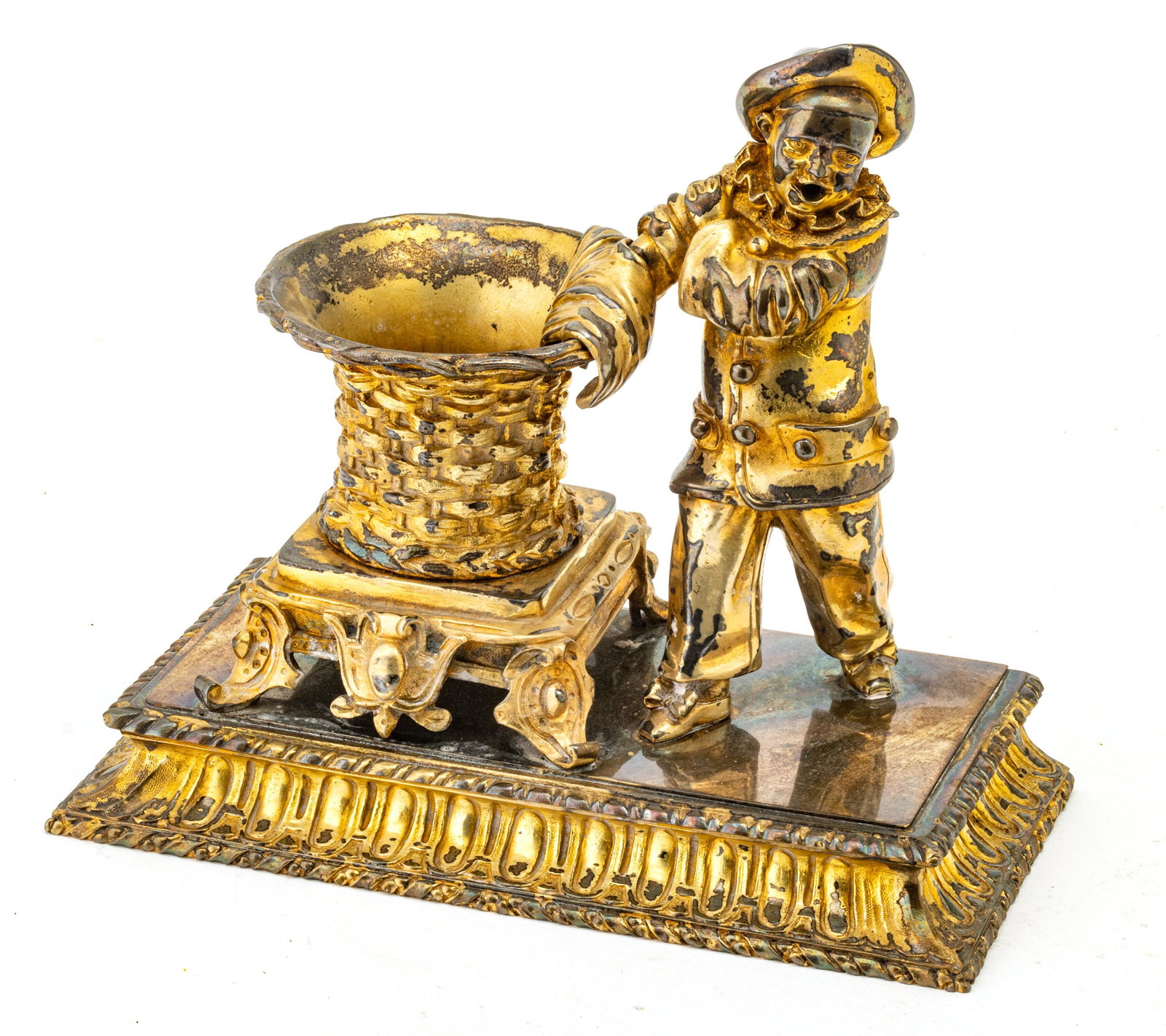 SILVER PLATED INKSTAND, C. 1910 H 7" W 8.5" D 4.25": SILVER PLATED INKSTAND, C. 1910 H 7" W 8.5" D 4.25" Depicting a clown with hinged hat standing next to "woven" planter or inkwell. Provenance: Estate of Joan Young, Kalamazoo, Mi.