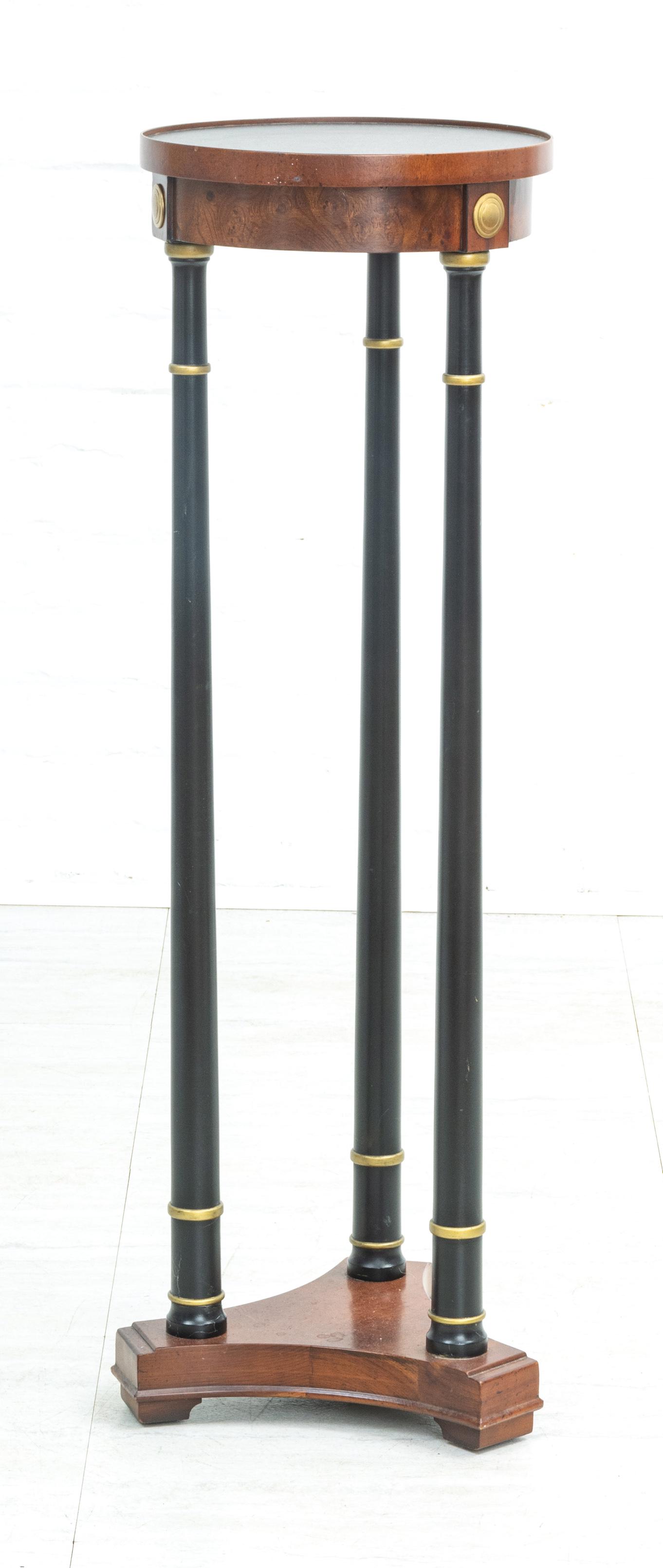 EMPIRE STYLE EBONIZED WOOD AND MAHOGANY PEDESTAL H 37": EMPIRE STYLE EBONIZED WOOD AND MAHOGANY PEDESTAL H 37" DIA 12" Three columns on a walnut triangular plinth. Provenance: Estate of Joan Young, Kalamazoo, Mi.