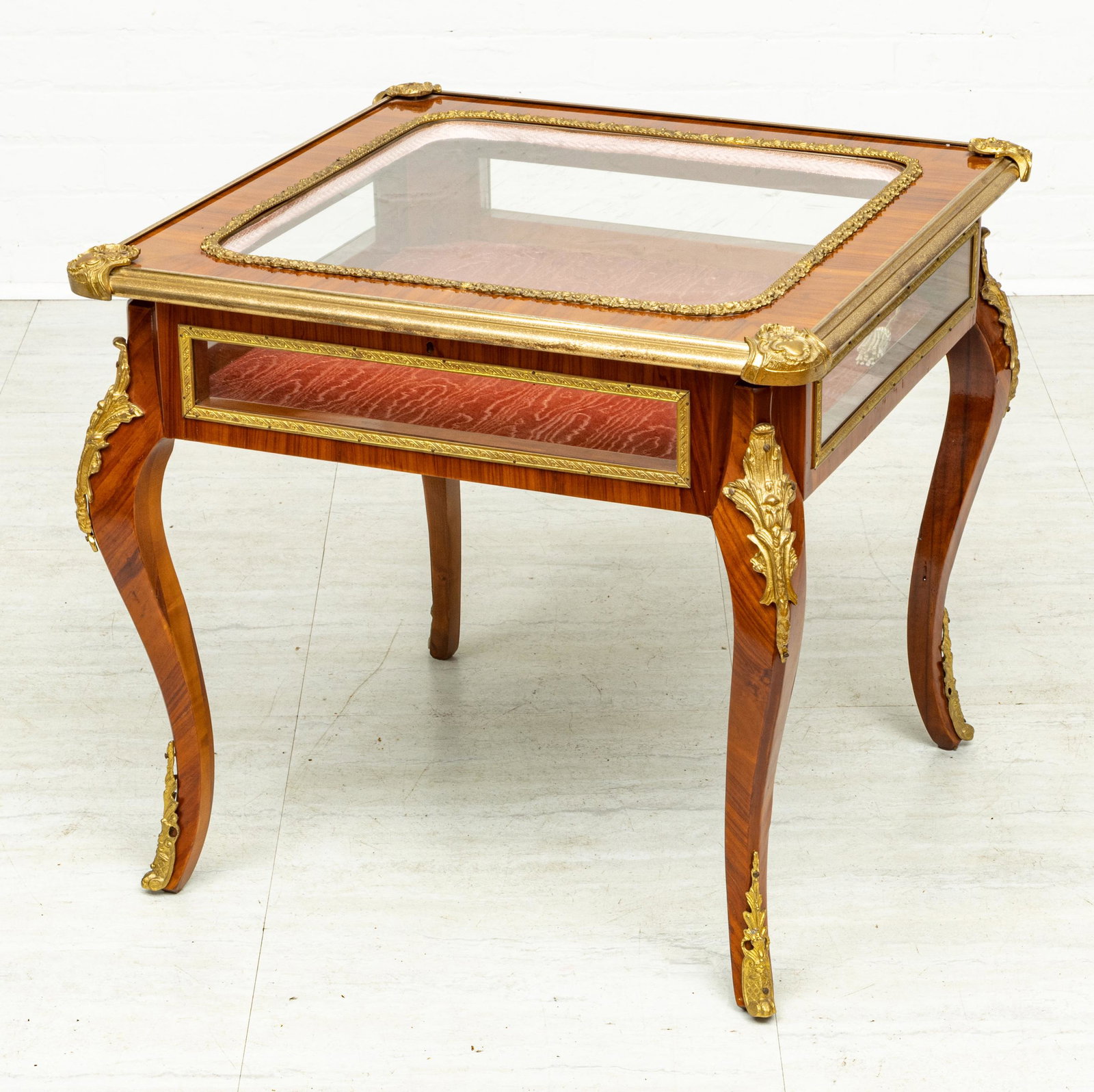 LOUIS XV STYLE DISPLAY CASE H 24.5" W 27" D 27": LOUIS XV STYLE DISPLAY CASE H 24.5" W 27" D 27" Fruitwood with bronze ormolu along the legs and edges. Five glass viewing panels. Hinged cover opening.