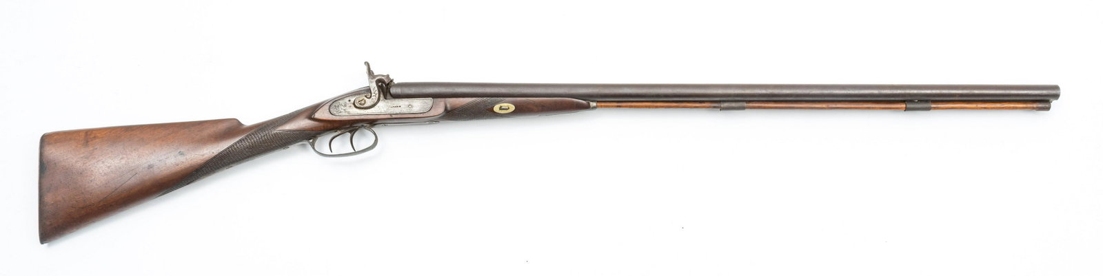 PARKER SIDE BY SIDE PERCUSSION CAP SHOTGUN, 12 GA.,: PARKER SIDE BY SIDE PERCUSSION CAP SHOTGUN, 12 GA., 19TH C., L 32" BARREL Lock plates marked Parker. Barrel rib marked "Steel". Knurled hammer, double trigger. 1/3 wood stock with metal buttplate. Ove