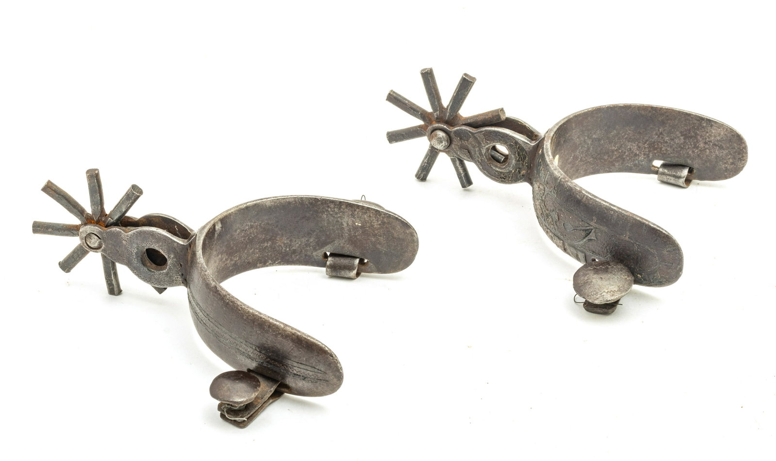 WESTERN STYLE SPURS, EARLY 20TH C., PAIR, W 3.5", L 6": WESTERN STYLE SPURS, EARLY 20TH C., PAIR, W 3.5", L 6" A pair of Western style spurs having silvered horseshoe designs. Provenance: Estate of Joan Young, Kalamazoo, Mi.