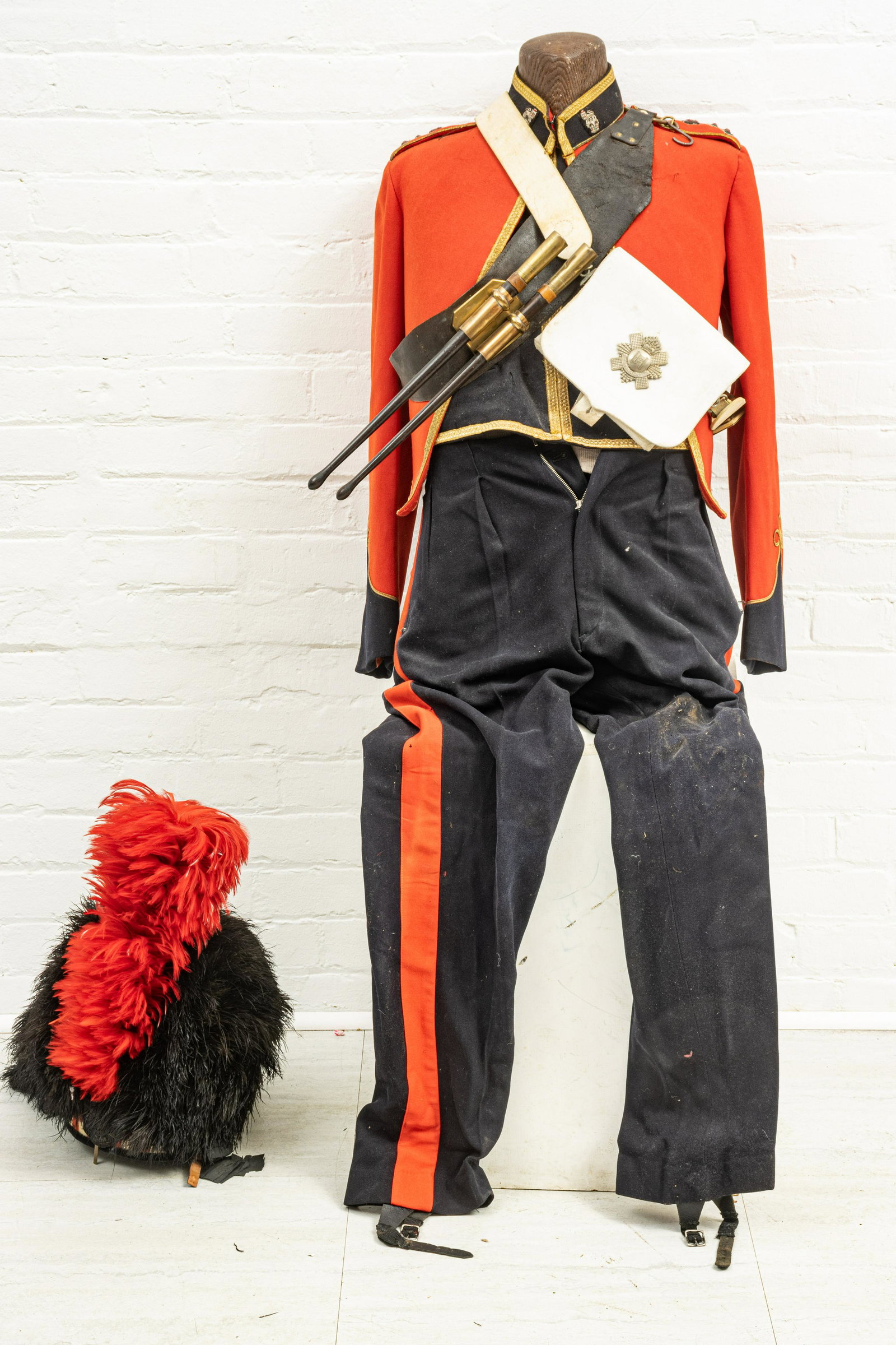 CANADIAN FORMAL MILITARY UNIFORMS WITH FEATHER BONNETS,: CANADIAN FORMAL MILITARY UNIFORMS WITH FEATHER BONNETS, 20TH C., H 26", W 20" (UNIFORMS ONLY), THE 48TH HIGHLANDERS AND THE ROYAL HIGHLAND FUSILIERS One uniform of the Royal Highland Fusiliers of Cana