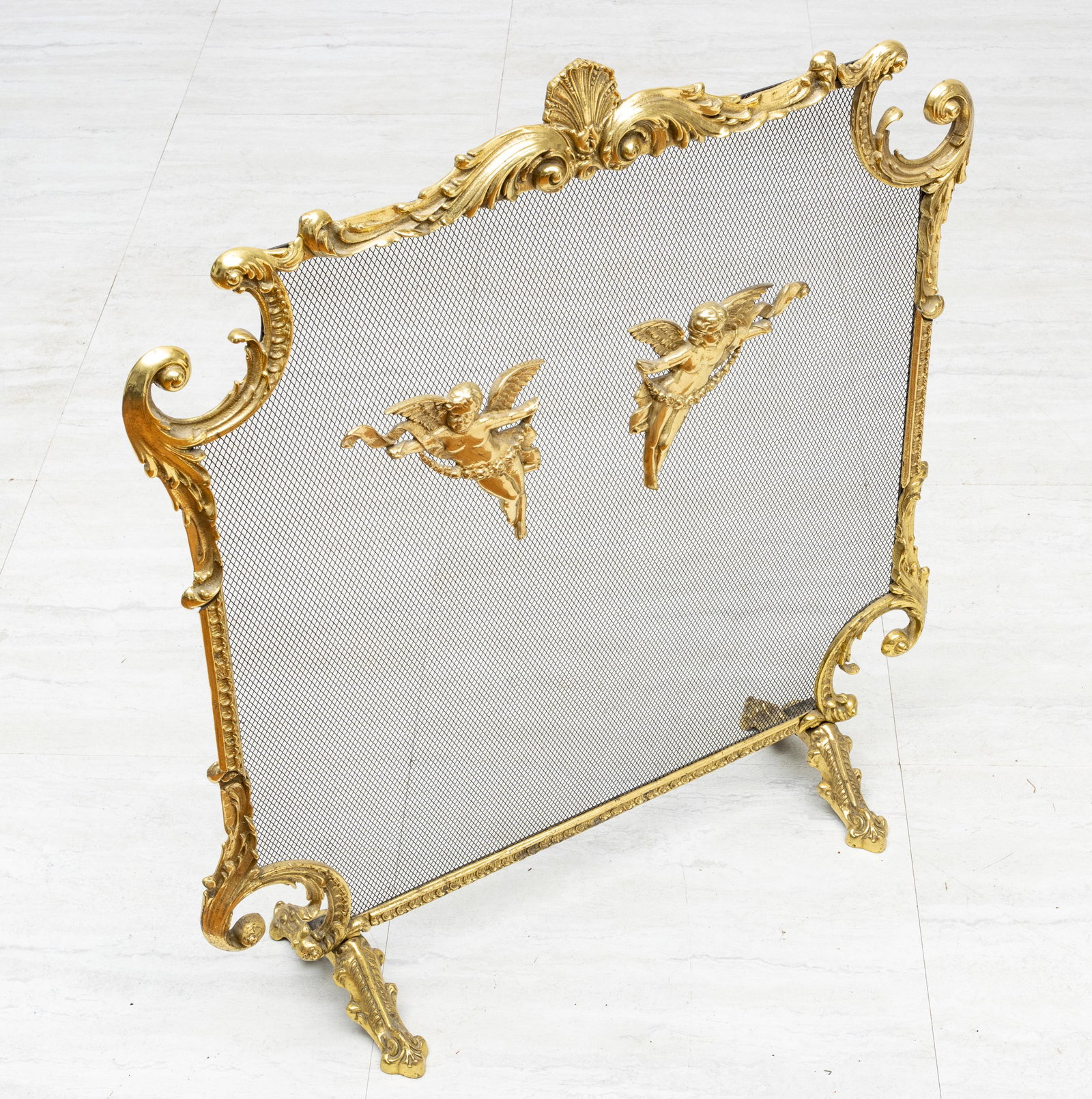 FRENCH STYLE BRASS FIREPLACE SCREEEN H 31" W 28": FRENCH STYLE BRASS FIREPLACE SCREEEN H 31" W 28" Free-standing. Cherub forms mounted to screen. Shell and acanthus crest.
