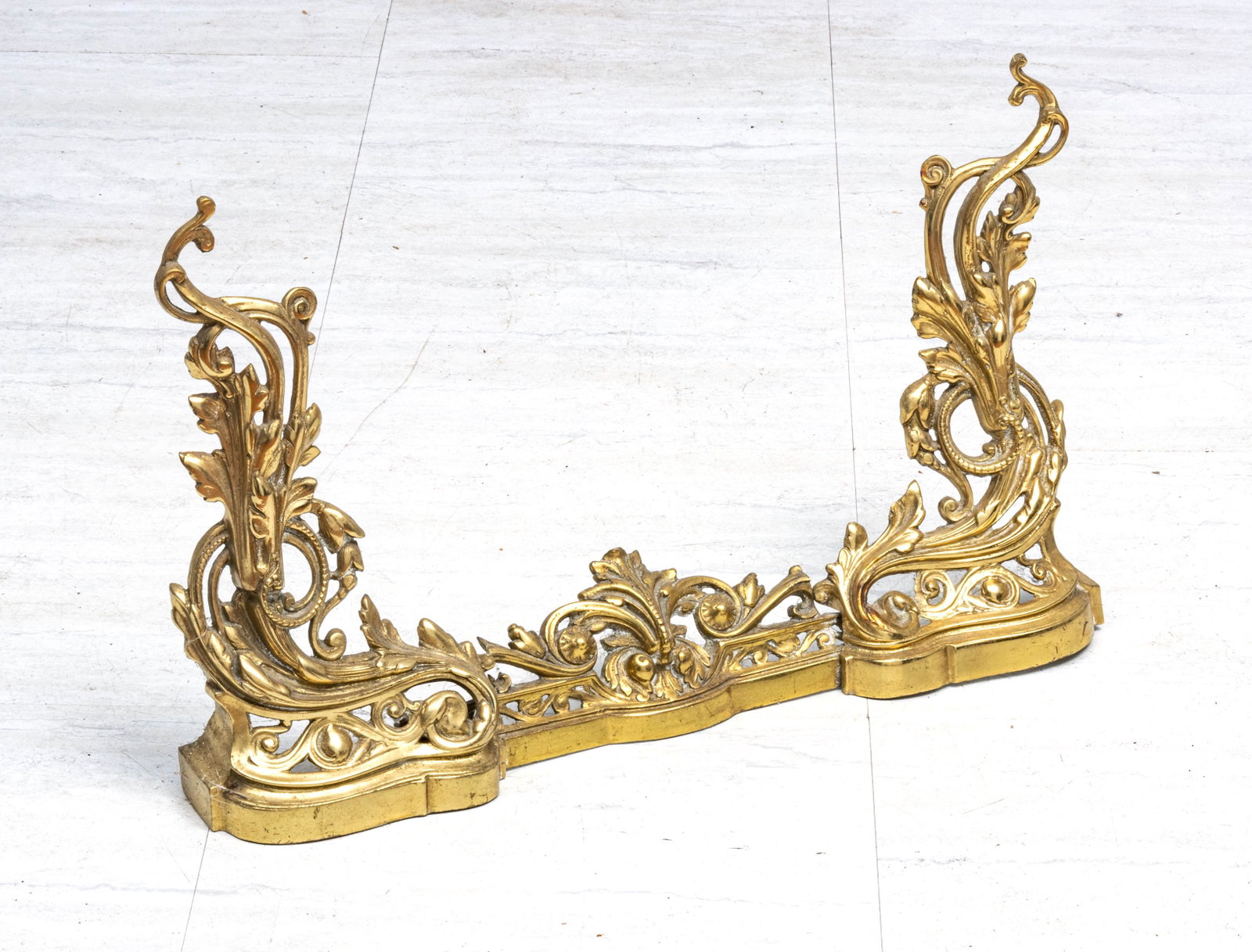 FRENCH STYLE GOLD BRONZE FIREPLACE FENDER, C 1900 H 17": FRENCH STYLE GOLD BRONZE FIREPLACE FENDER, C 1900 H 17" W 4" L 28" Baroque style. In three parts. Circa 1900. Provenance: Estate of Joan Young, Kalamazoo, Mi.
