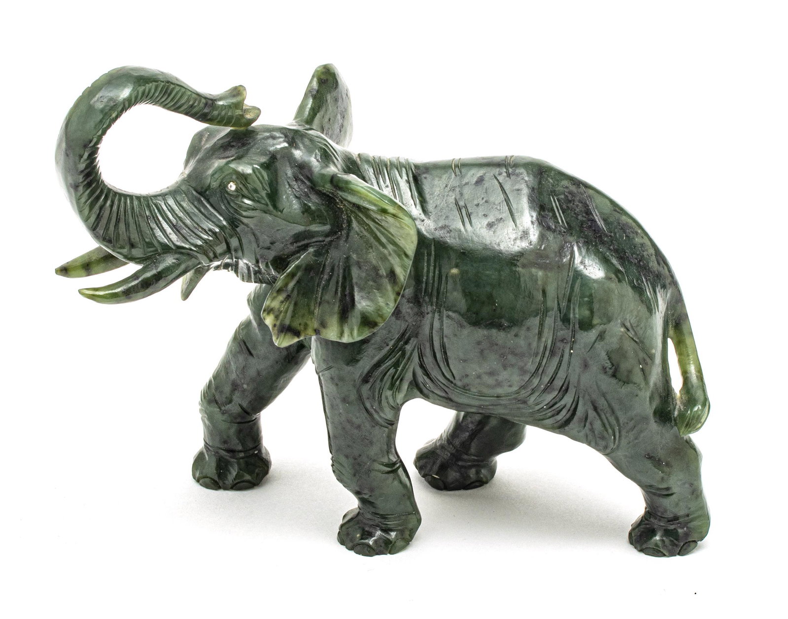 SPINACH JADE ELEPHANT, WITH DIAMOND EYES, H 5", L 6": SPINACH JADE ELEPHANT, WITH DIAMOND EYES, H 5", L 6" A spinach jade elephant with diamond eyes. Width 3". Provenance: Estate of Joan Young, Kalamazoo, Mi.