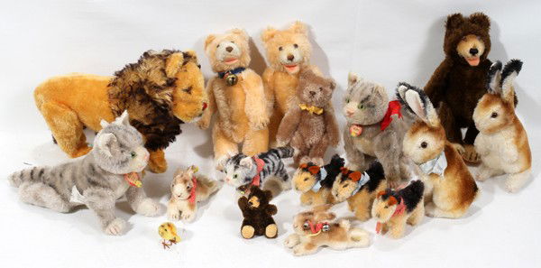 STEIFF STUFFED ANIMALS, SEVENTEEN: STEIFF STUFFED ANIMALS, SEVENTEEN:Walking lion 12", 2 seated bunnies H 9", 2 resting bunnies L 4", 3 wire haired terriers L 3 1/2", 3 cats [ one at 4 1/2" and two at 8"], 4 bears [three at 8 1/2" one