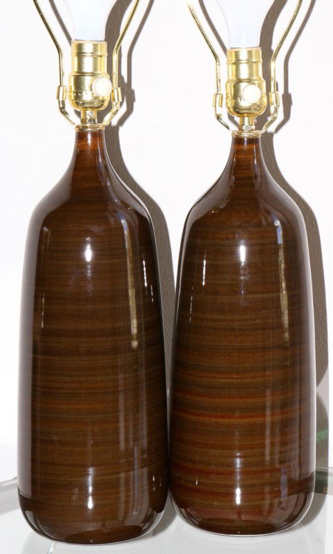 GLAZED CERAMIC LAMPS, CONTEMPORARY, PAIR, H 15": GLAZED CERAMIC LAMPS, CONTEMPORARY, PAIR, H 15":Having a predominately brown coloration with striped accents. No apparent markings. Includes harps and shades.