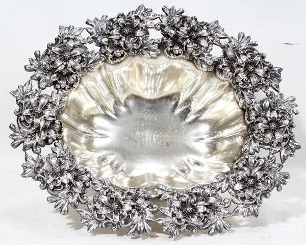 MAUSER MFG. CO. STERLING CENTERPIECE BOWL: MAUSER MFG. CO. STERLING CENTERPIECE BOWL, C. 1900, H 5", L 13":Oblong shape with a pierced floral border, the ribbed bowl with "ML" script monogram at the well and is raised on a conforming base; sta