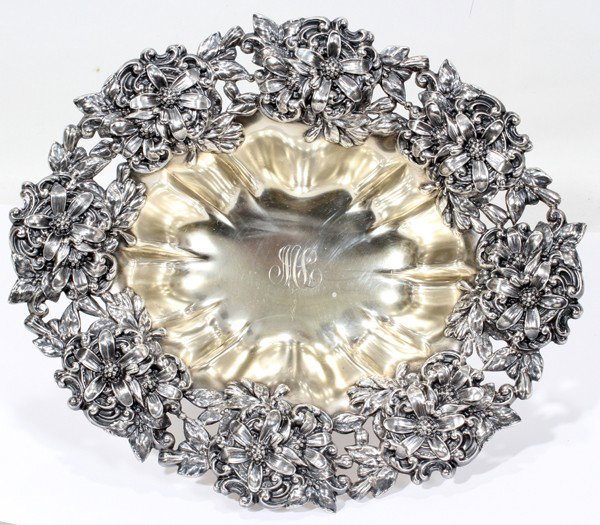 MAUSER MFG. CO. STERLING CENTERPIECE BOWL: MAUSER MFG. CO. STERLING CENTERPIECE BOWL, C. 1900, H 4", L 11":En suite with preceding lots, oblong shape with a pierced floral border, the ribbed bowl with "ML" script monogram at the well and is ra