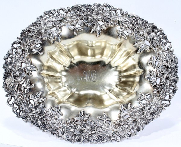 MAUSER MFG. CO. STERLING BOWL, C. 1900, H 3": MAUSER MFG. CO. STERLING BOWL, C. 1900, H 3", L 8 1/2":Oblong shape with a pierced floral border, the ribbed bowl with "ML" script monogram at the well and is raised on a conforming base; stamped unic