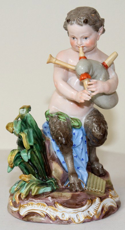 MEISSEN PORCELAIN FIGURE, SATYR WITH BAGPIPE, : MEISSEN PORCELAIN FIGURE, SATYR WITH BAGPIPE, 19TH C., H 6 1/4":Marked in blue under glaze with crossed swords, D 46, and numbered 28 in red. From the collection of Joseph and Norina Simon, Grosse Poi