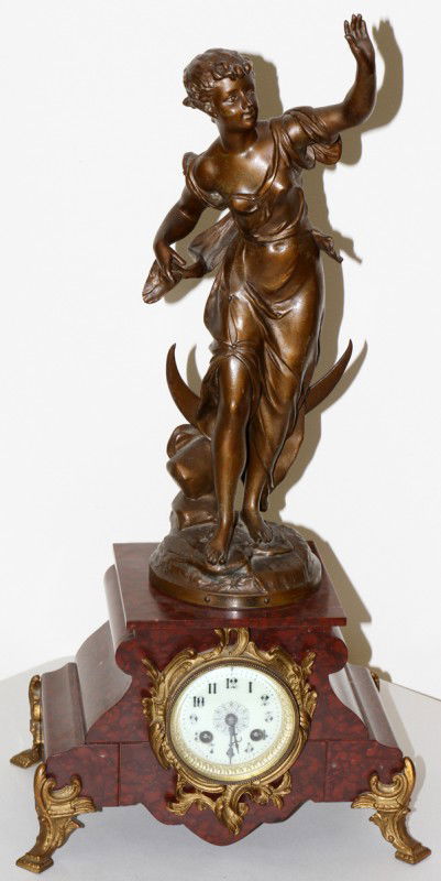 AFTER BRUCHON, SPELTER & ROUGE MARBLE CLOCK,: AFTER BRUCHON, SPELTER & ROUGE MARBLE FIGURAL CLOCK, 'LA AURORE', H 25", W 12":Measures H.24 1/2" x 12" x 8". From the collection of Joseph and Norina Simon, Grosse Pointe Farms, Mi.