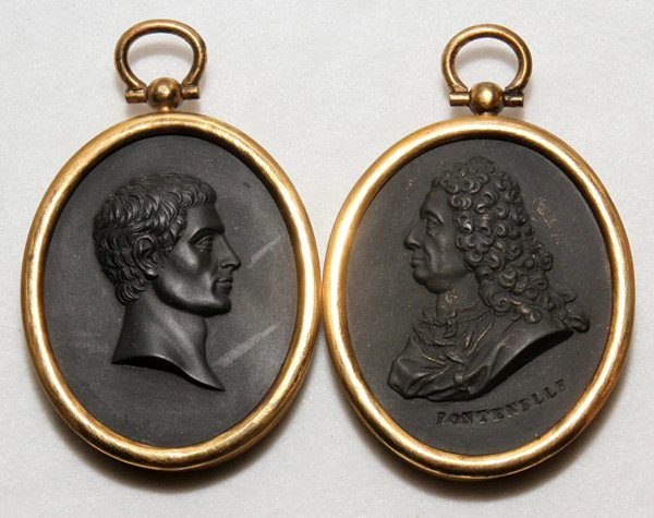 ENGLISH BASALT INTAGLIO MEDALLIONS, 'BRUTUS' & : ENGLISH BASALT INTAGLIO MEDALLIONS, 'BRUTUS' & 'FONTENELLE', C. 1800, 2" X 1", TWO, FRAMED:Including 1 depicting "M. Brutus", 2" x 1 1/2", and 1 "Fontenelle", 2 1/4" x 1 3/4"; each in a brass frame.