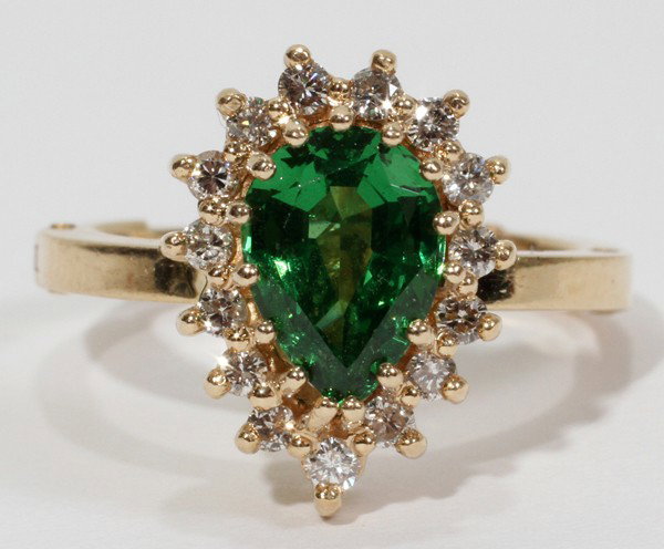 14KT Y/GOLD TSAVORITE GARNET AND DIAMOND RING: 14 KT YELLOW GOLD TSAVORITE GARNET 1.17 CT AND DIAMOND RING:One pear shape natural tsavorite set with fifteen prongs; fifteen round brilliant diamonds at 1/2 ct total set in prongs around the tsavorit