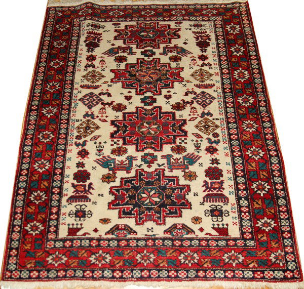 SHIRAZ IRANIAN RUG, 46" X 57", SEMI-ANTIQUE: SHIRAZ IRANIAN RUG, 46" X 57", SEMI-ANTIQUE:Ivory field, red border. Three medallions