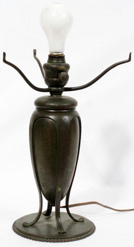 TIFFANY STYLE PATINATED METAL LAMP BASE, H 13": TIFFANY STYLE PATINATED METAL LAMP BASE, H 13", W 9":Arts and crafts style lamp base having a medium brown patina. Stamped "Tiffany Studios New York 441" at the underside.