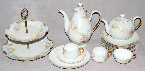 HUTCHENREUTHER PORCELAIN DESSERT SERVICE, 45: HUTCHENREUTHER HAND PAINTED PORCELAIN DESSERT SERVICE, 45 PCS.:Service for twelve includes plates, cups and saucers, coffeepot, tea pot, covered sugar, creamer, two two-tier cookie trivet, three foote