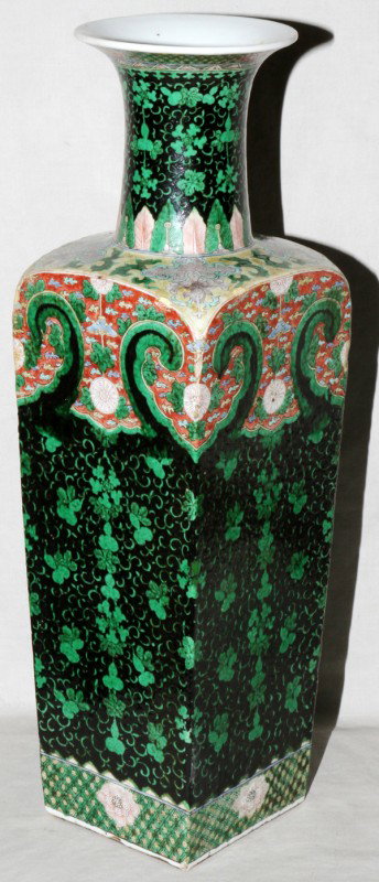 CHINESE FAMILLE NOIRE PORCELAIN VASE, H 20 1/2": CHINESE FAMILLE NOIRE PORCELAIN VASE, H 20 1/2", L 6", D 6":Square sectioned vase with dark ground with green gourd vines chrysanthemum and lotus design. Provenance: Originally in the collection of th