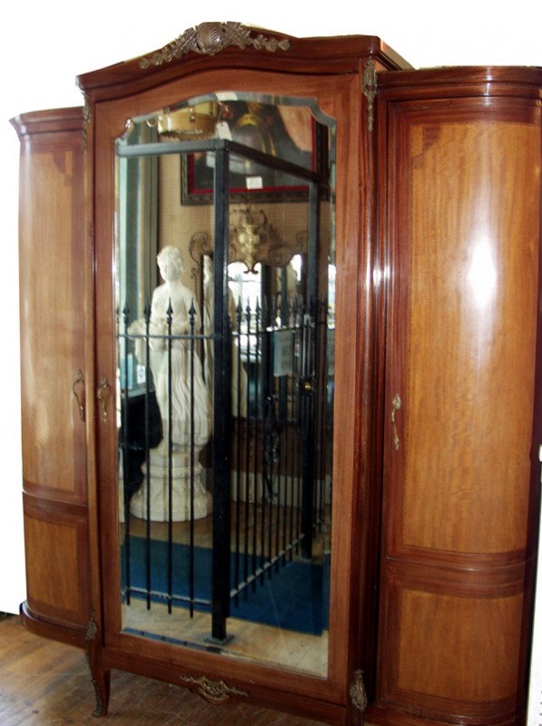 FRENCH MAHOGANY ARMOIRE, C. 1930, H 96", W 80": FRENCH MAHOGANY ARMOIRE, C. 1930, H 96", W 80", D 23":3 full length cabinets with full length doors, center door has full length beveled glass mirror; flanking the center door, the side doors on each 