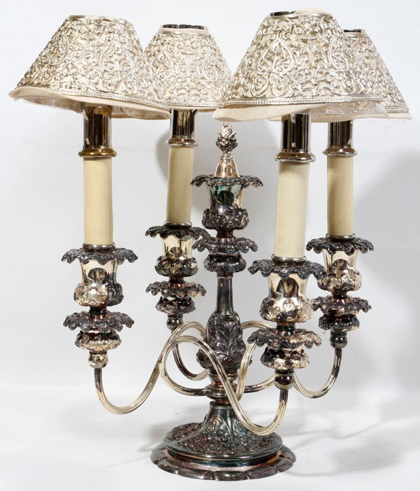 SILVERPLATE FOUR-ARM CANDELABRUM, H 11", W 9": SILVERPLATE FOUR-ARM CANDELABRUM, H 11", W 9":Together with 4 pierced shades, probably sterling, and 4 chrome candle nozzles. Circa 1920 From the collection of Dr Douglas Crary, Ann Arbor, Mi.