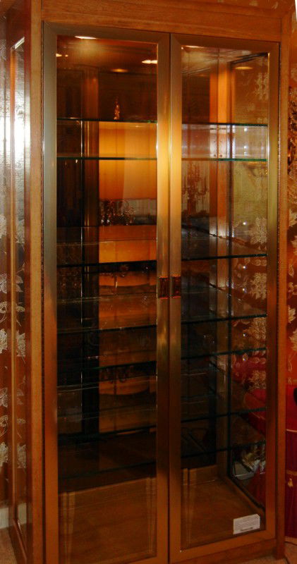 THOMASVILLE BRASS, WOOD, GLASS DISPLAY CABINETS: THOMASVILLE BRASS, WOOD & GLASS DISPLAY CABINETS, THREE, H 79", W 34", D 17":Each having gilt metal frames, side glass panels, mirrored back, eight glass shelves.