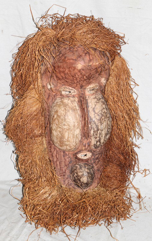 BAYAKA CARVED & POLYCHROME WOOD KAKUNGU MASK, : BAYAKA CARVED & POLYCHROME WOOD KAKUNGU MASK, H 28", W 17":Having straw accents and polychrome in ivory and mauve in a distressed form.