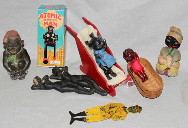 BLACK FOLK ART MEMORABILIA, 6 PCS.: BLACK FOLK ART MEMORABILIA, 6 PCS.:Includes Atomic Robot Man in box, tin wind up; spelter inkwell (no crystal); metal dancer, H 16"; 3 small dolls, H 3".