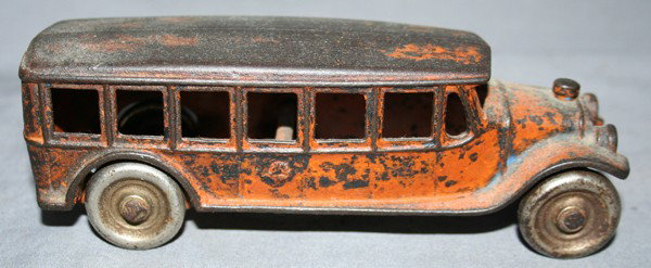 CAST IRON YELLOW SCHOOL BUS, C1920, H 2", L 6": CAST IRON YELLOW SCHOOL BUS, C1920, H 2", L 6":having original orange paint;