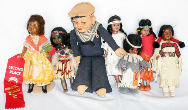 AMERICAN INDIAN DOLLS & OTHERS (7), H 6"-11": AMERICAN INDIAN DOLLS & OTHERS (7), EARLY-MID 20TH C., H 6"-11":Including 1 black doll marked "SFBJ", 1 composition head sailor doll with fabric body, and 5 American Indian dolls, plastic with sleep e
