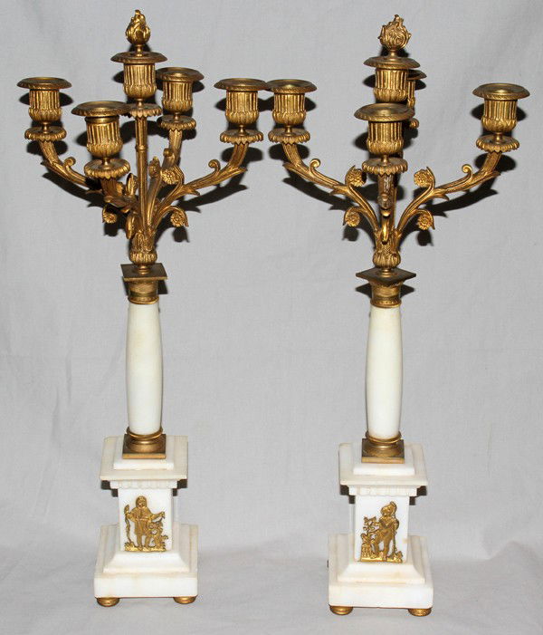 ALABASTER & BRONZE FIVE LIGHT FOOTED CANDELABRA: ALABASTER AND BRONZE FIVE LIGHT FOOTED CANDELABRA, PAIR, H 21", DIA 9 1/2":having bronze arms, alabaster shafts and bases; bronze button feet and classical figures on bases;