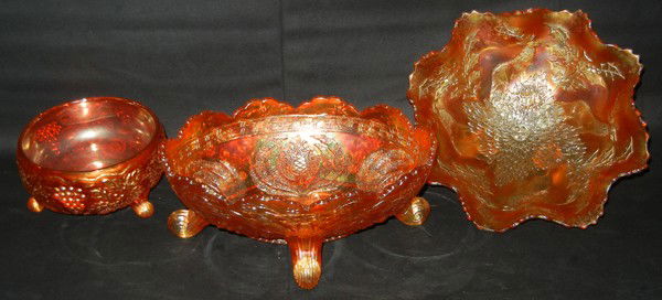 CARNIVAL GLASS GROUPING, THREE: CARNIVAL GLASS GROUPING, THREE:Oblong footed open bowl with beaded edge, L 10 1/2"; one ruffled edge open footed bowl, dia. 10 1/2"; and one footed candy dish, dia. 5 1/2".