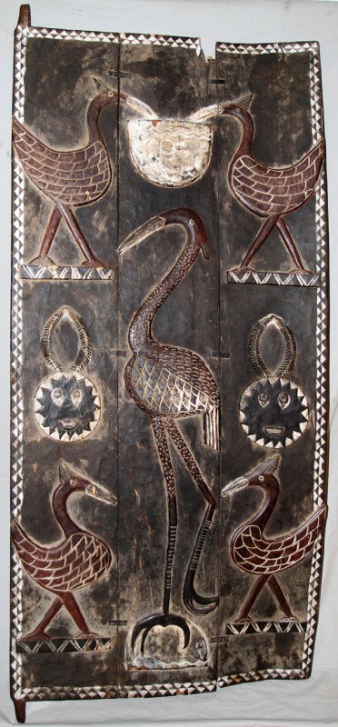 IVORY COAST BAULE TRIBE DOOR, H 78" X 34": IVORY COAST BAULE TRIBE DOOR, H 78" X 34":three wood pieces form the door; depicting hand carved birds and masks in relief;